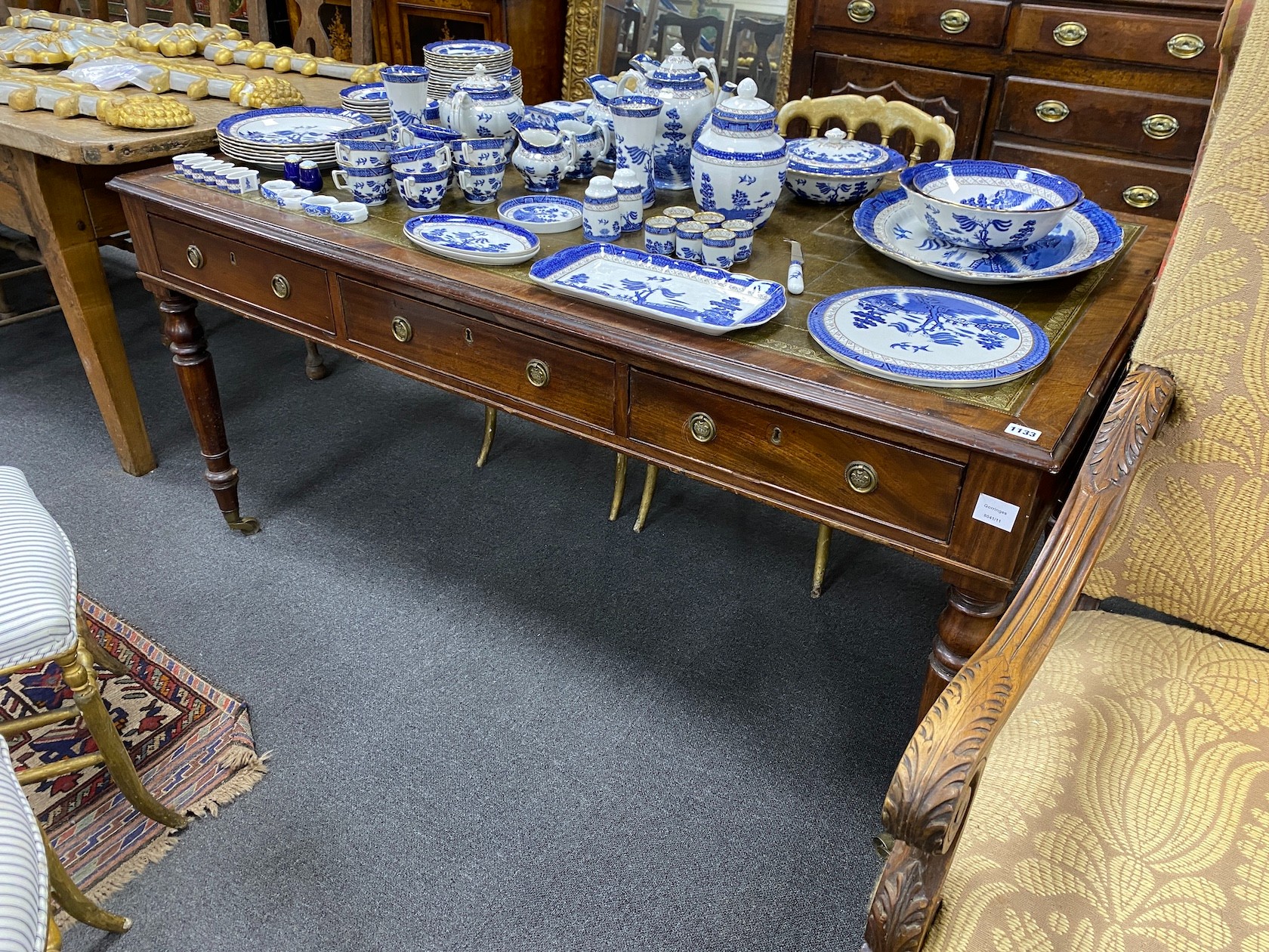 A William IV mahogany three drawer writing table, with a a green inset leather top, width 154cm, depth 88cm, height 73cm